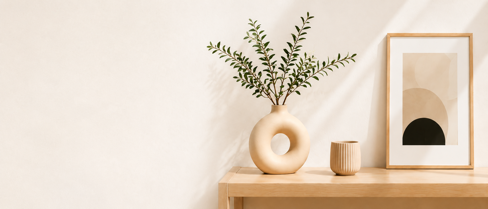 Minimal home decor with vase and framed wall art