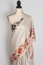 Rita | Cement White Soft Satin Saree with Traditional Kolka Prints