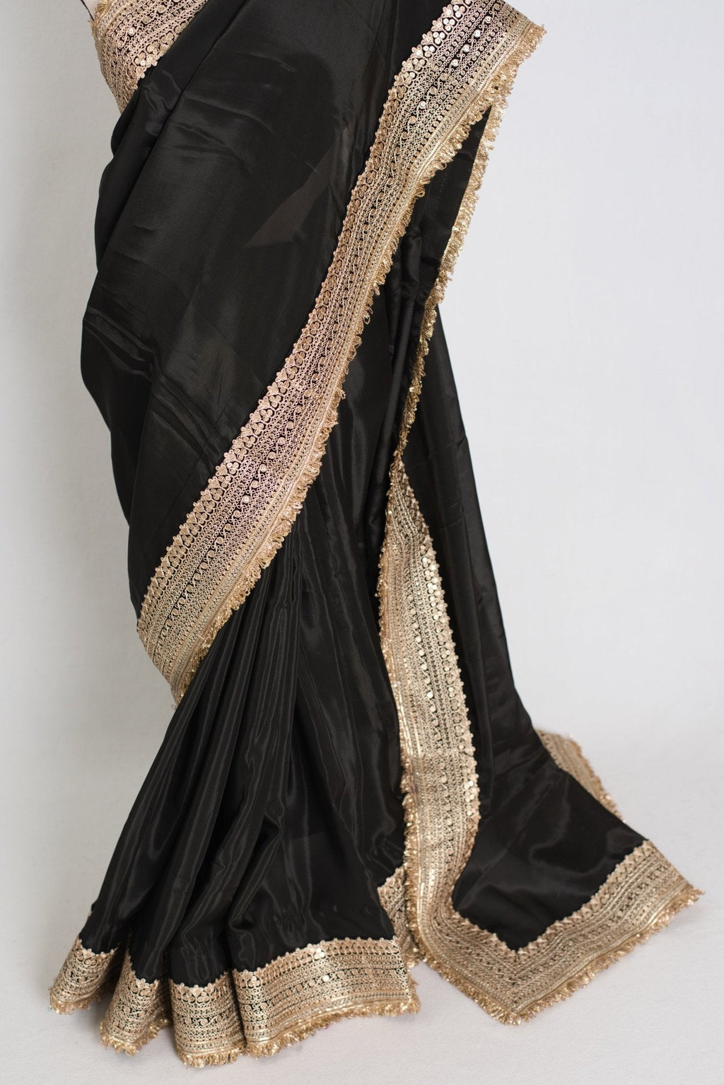 Arifa : Designer Semi Satin Black Partywear Saree with Patched Gold Border