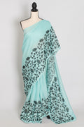 Dhriti | Turquoise Blue & Black Semi Kota Silk Saree | Artistic Floral Appliqué