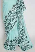 Dhriti | Turquoise Blue & Black Semi Kota Silk Saree | Artistic Floral Appliqué