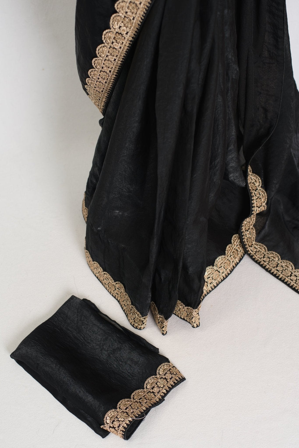 Farah : Designer Glass Tissue Black Partywear Saree with Patched Gold Border