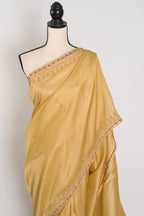 Nagma | Soft Tissue Gold Designer Saree with Hand Embroidery Border