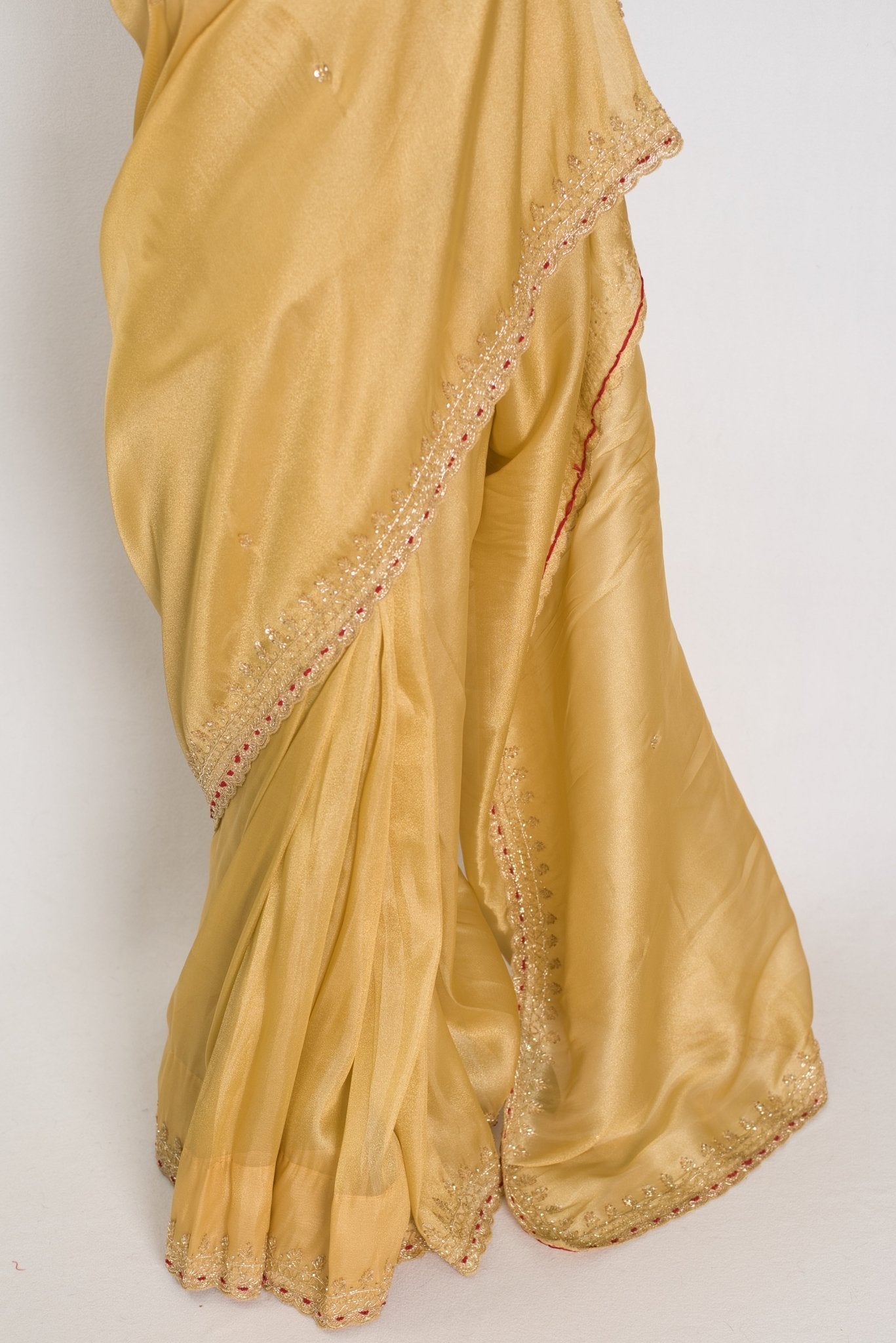 Nagma | Soft Tissue Gold Designer Saree with Hand Embroidery Border
