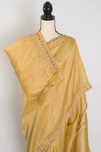Nagma | Soft Tissue Gold Designer Saree with Hand Embroidery Border