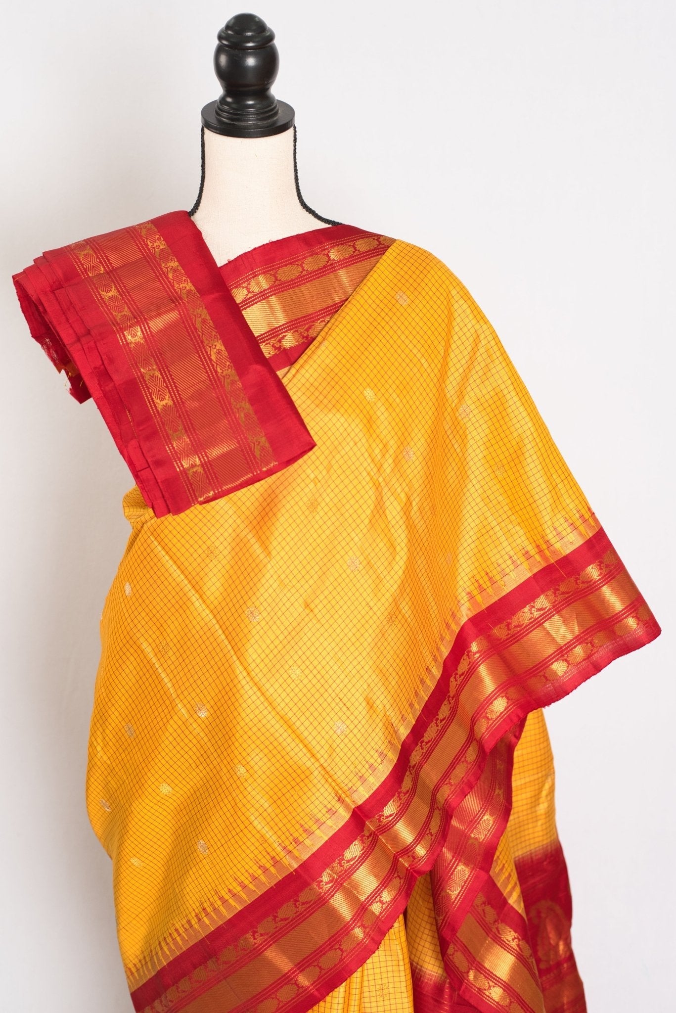 Vibha: Haldi Yellow and Red Checks Handwoven Gadwal Silk Saree with Golden Zari