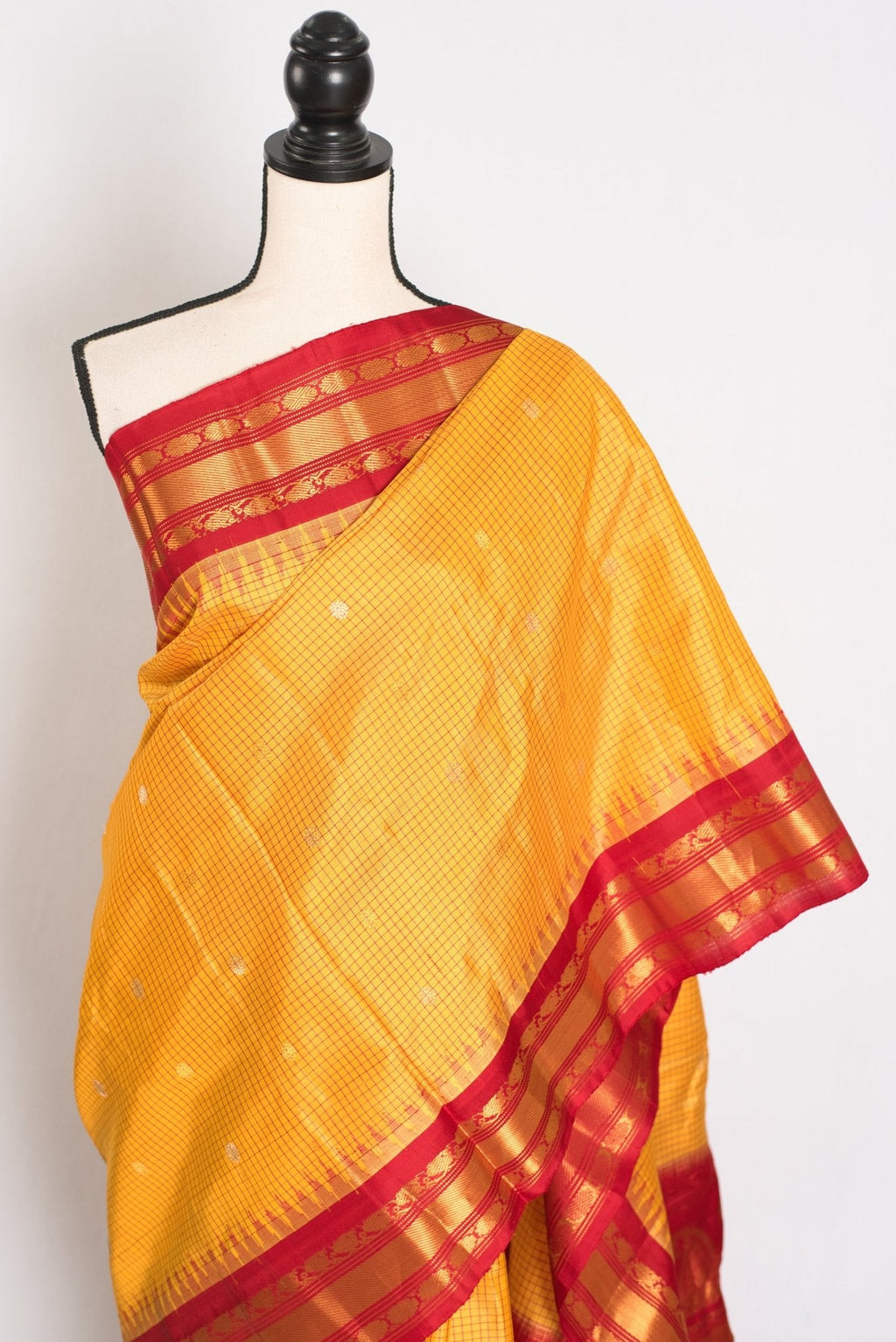 Vibha: Haldi Yellow and Red Checks Handwoven Gadwal Silk Saree with Golden Zari